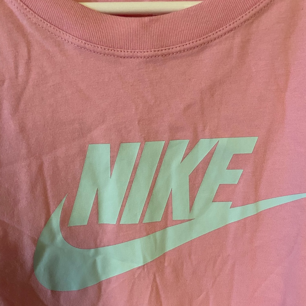 Pink nike cropped shirt.